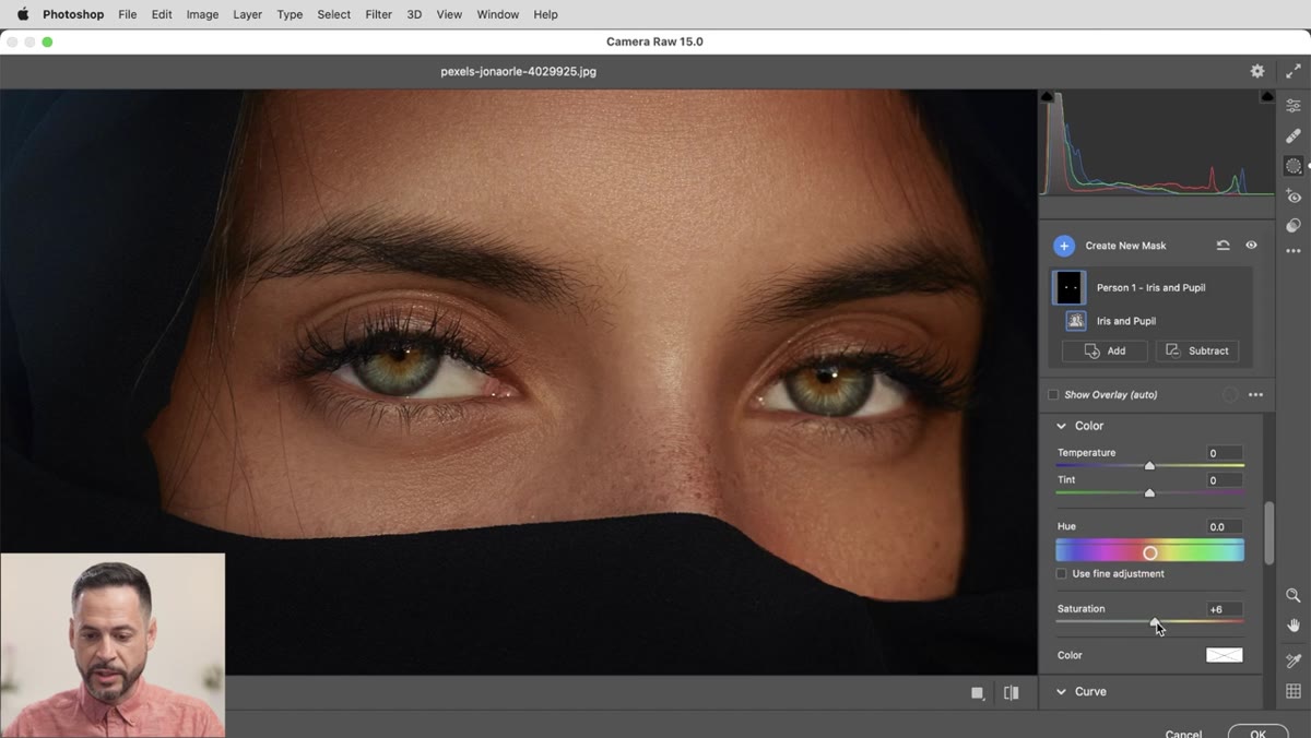 Saturation and exposure sliders being adjusted with the iris mask active